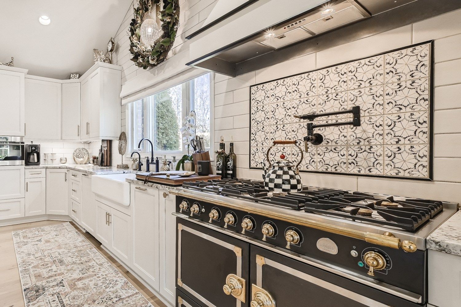 Remodeled kitchen with black and white accents by Cossentino & Sons for Custom Remodeling in Carroll County, MD