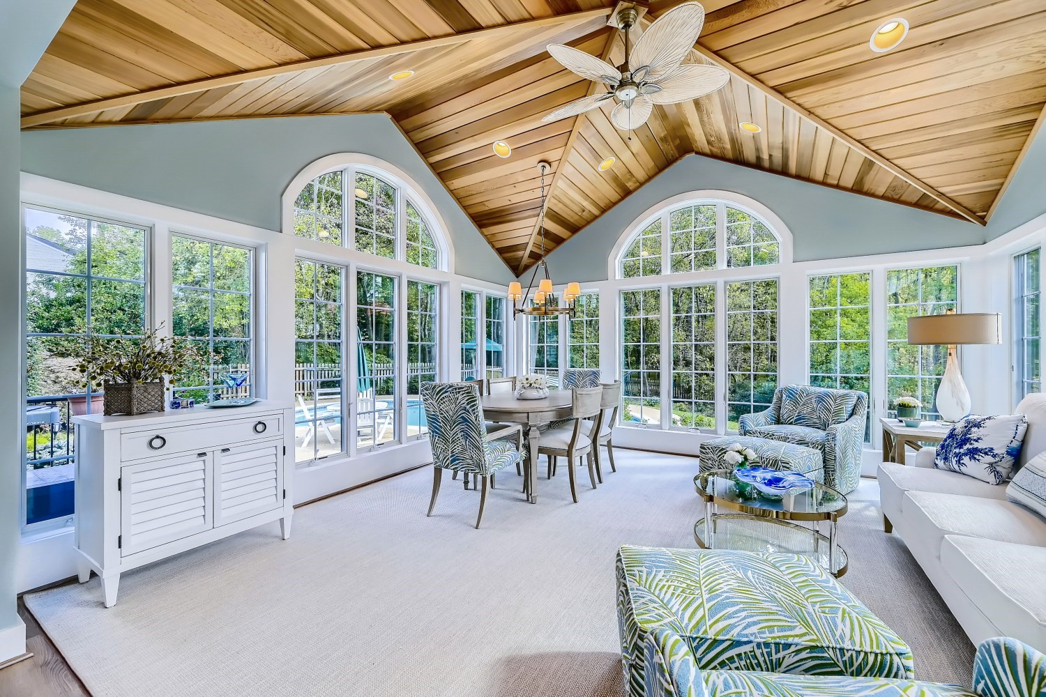 Remodeled sunroom with green and blue accents from Cossentino & Sons for Custom Remodeling in Carroll County, MD